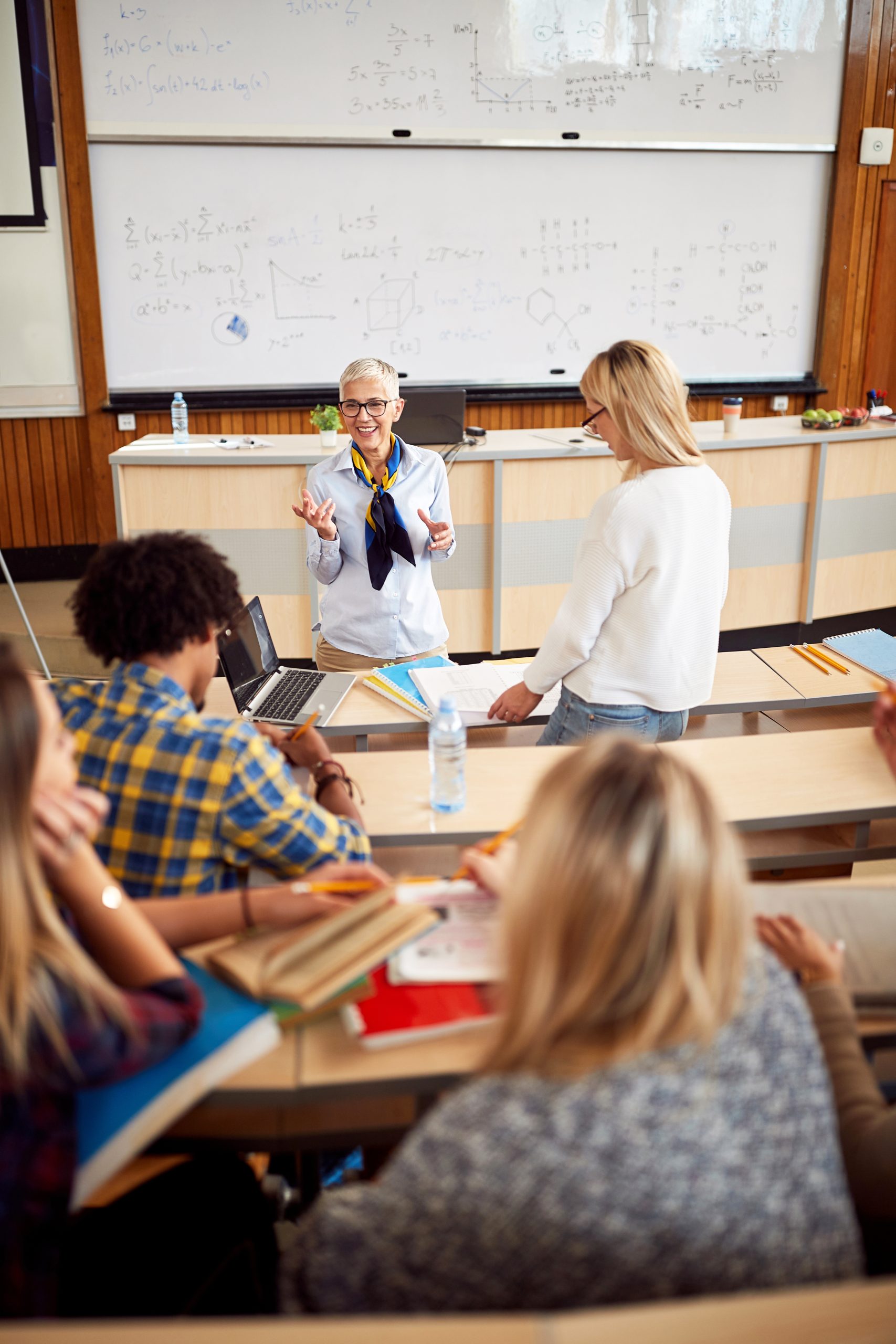 Professor giving lecture to her students
